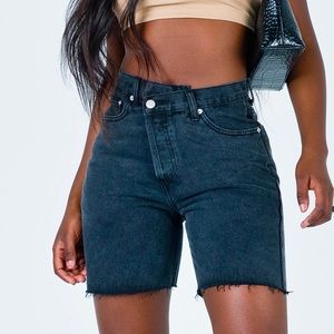 Princess Polly asymmetrical black denim shorts